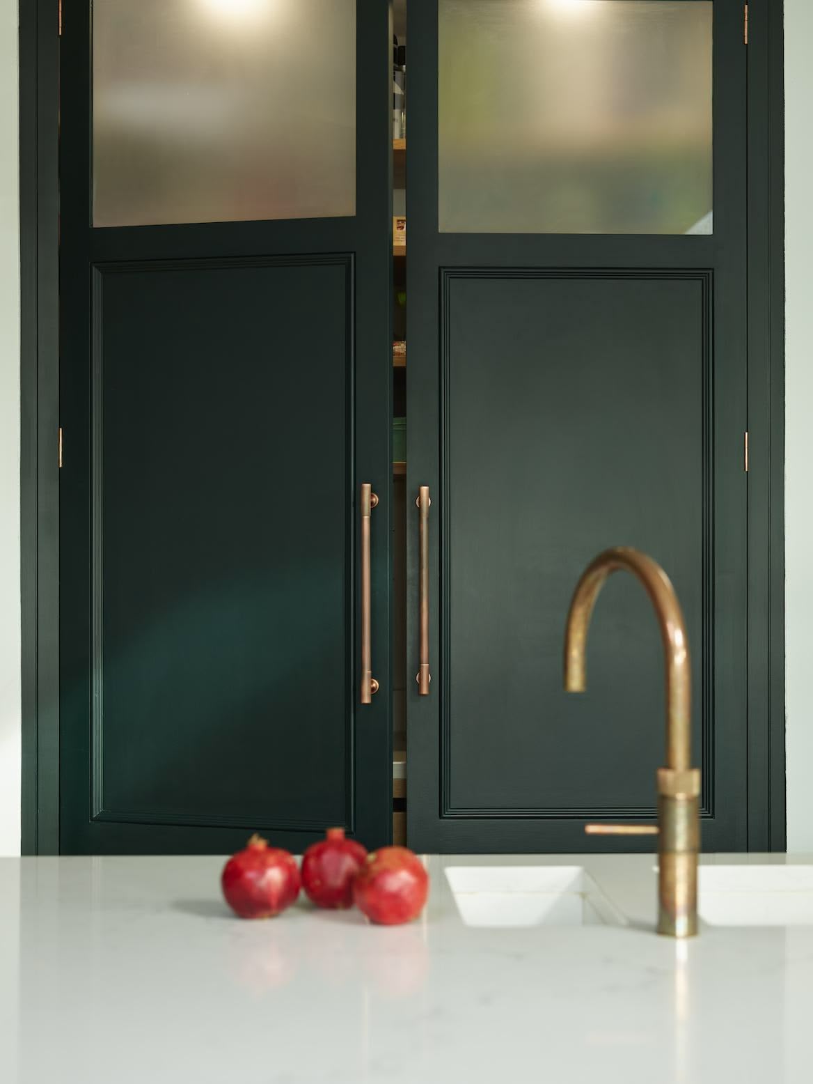 Large vibrant green double pantry doors