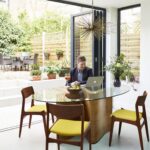Open plan dining area with glass wall door