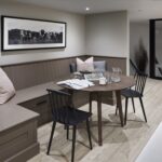 Open plan kitchen dining area featuring brown bench seating
