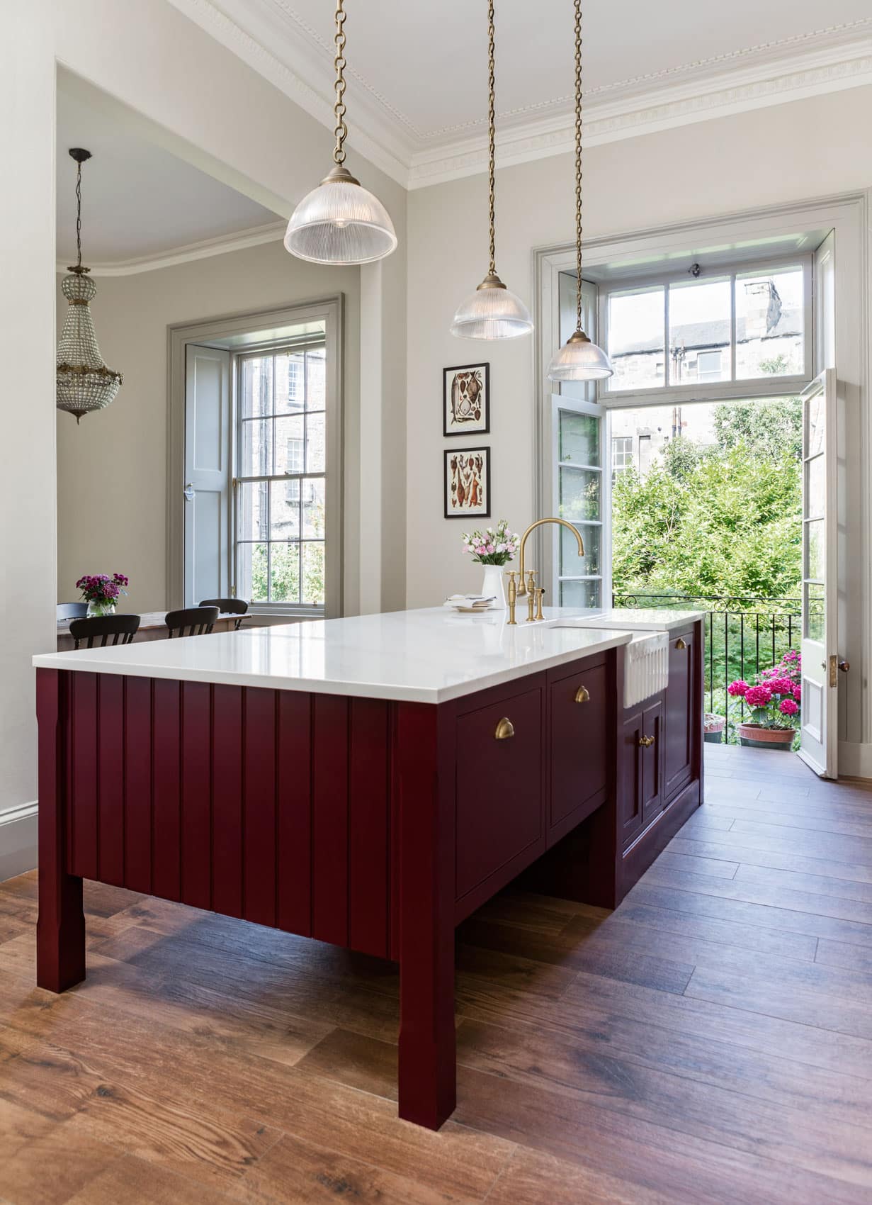 Burgundy kitchen island with white marble worktop