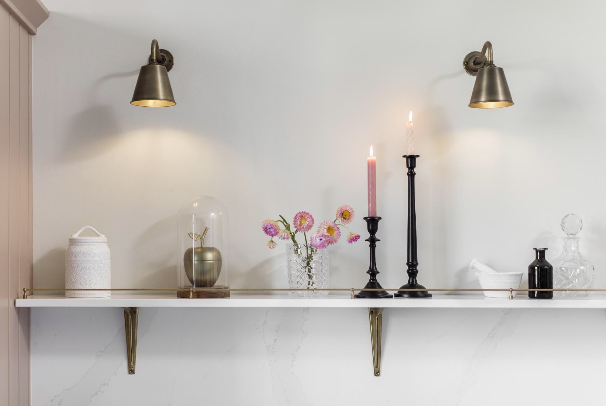 White open shelving against a white wall