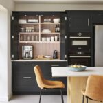 Harvey Jones black kitchen dresser open to show organised shelving
