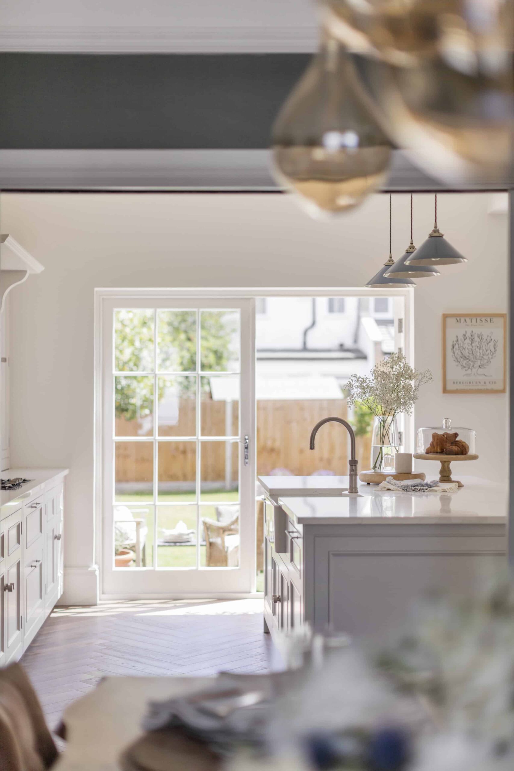 White Original kitchen design with open white French doors