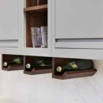 Wine storage underneath grey kitchen cabinetry