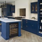 Blue kitchen island with wine fridge