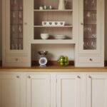 Harvey Jones cream kitchen dresser open to show organised shelving