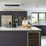 Dark grey kitchen island with wine fridge