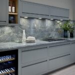 Green-grey Linear edge kitchen cabinetry with green-grey marble worktop