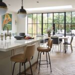 Soft grey kitchen island with natural coloured stools