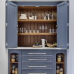 Harvey Jones blue kitchen dresser open to show organised shelving