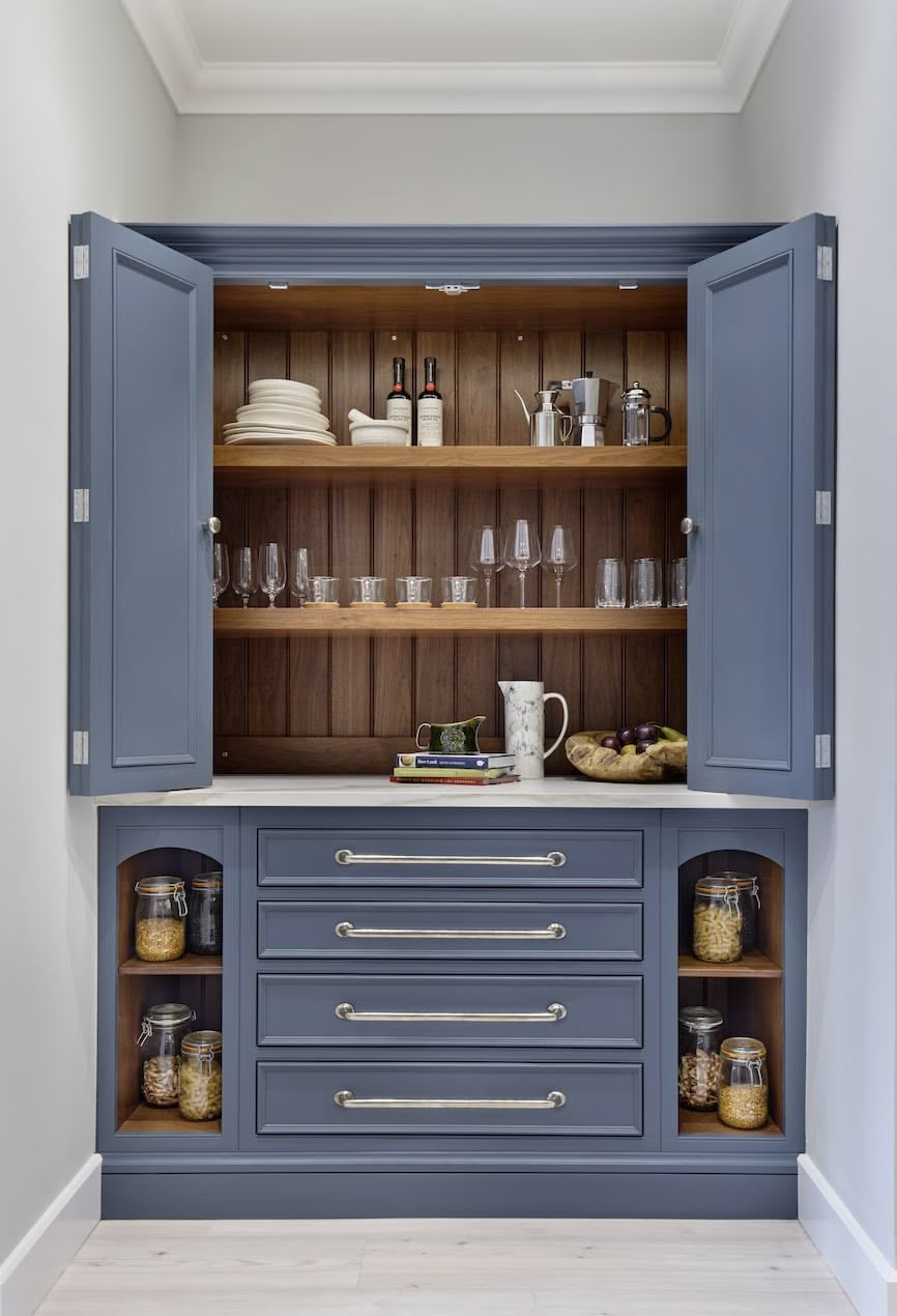 Harvey Jones blue kitchen dresser open to show organised shelving