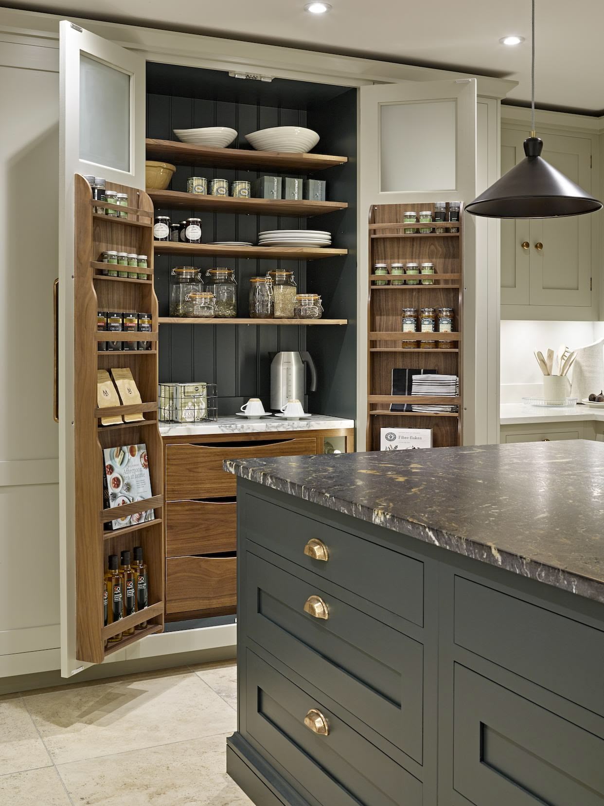 Open large pantry doors showing organised storage