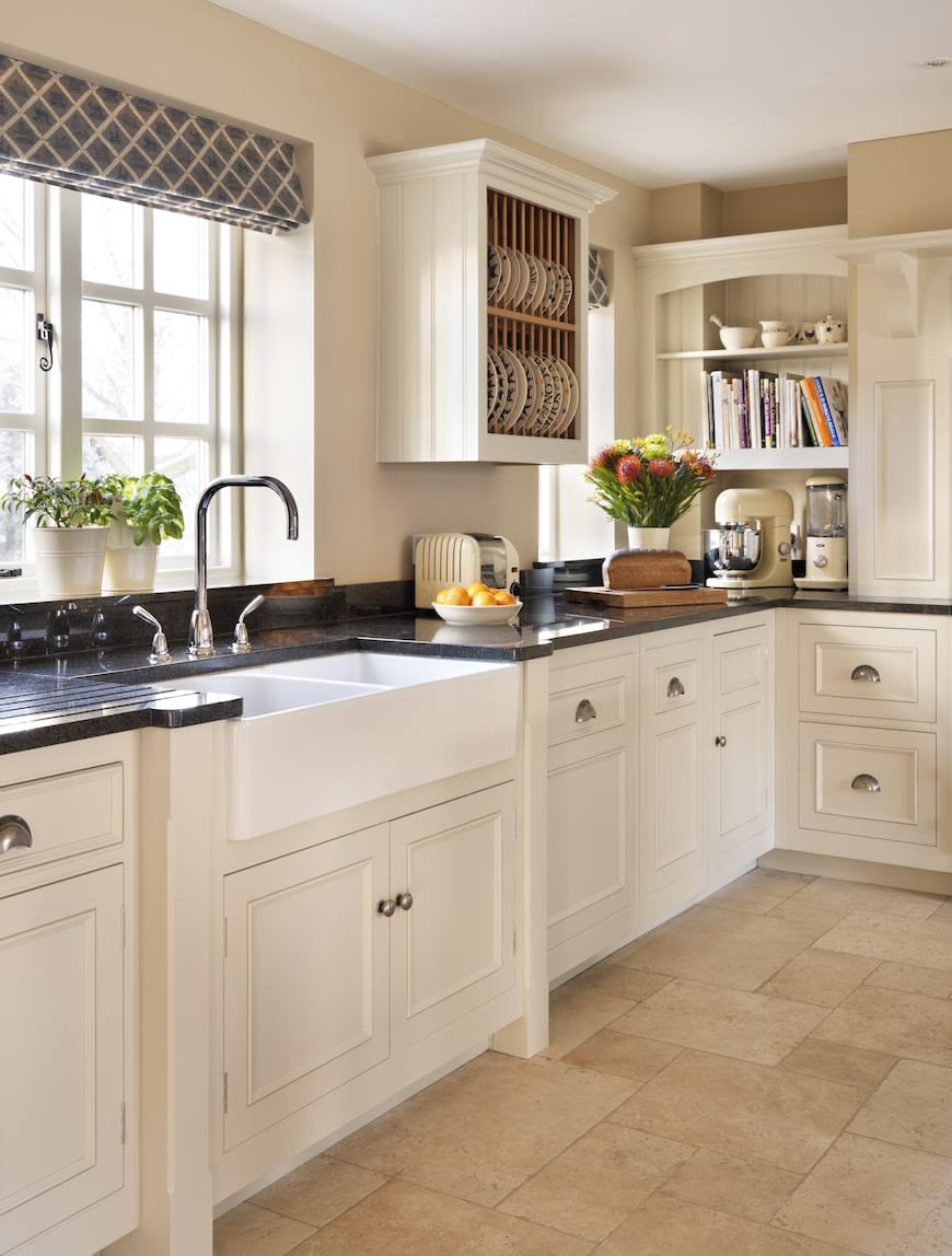 White kitchen Original cabinetry with black worktops