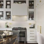White Linear kitchen cabinetry with glass window doors