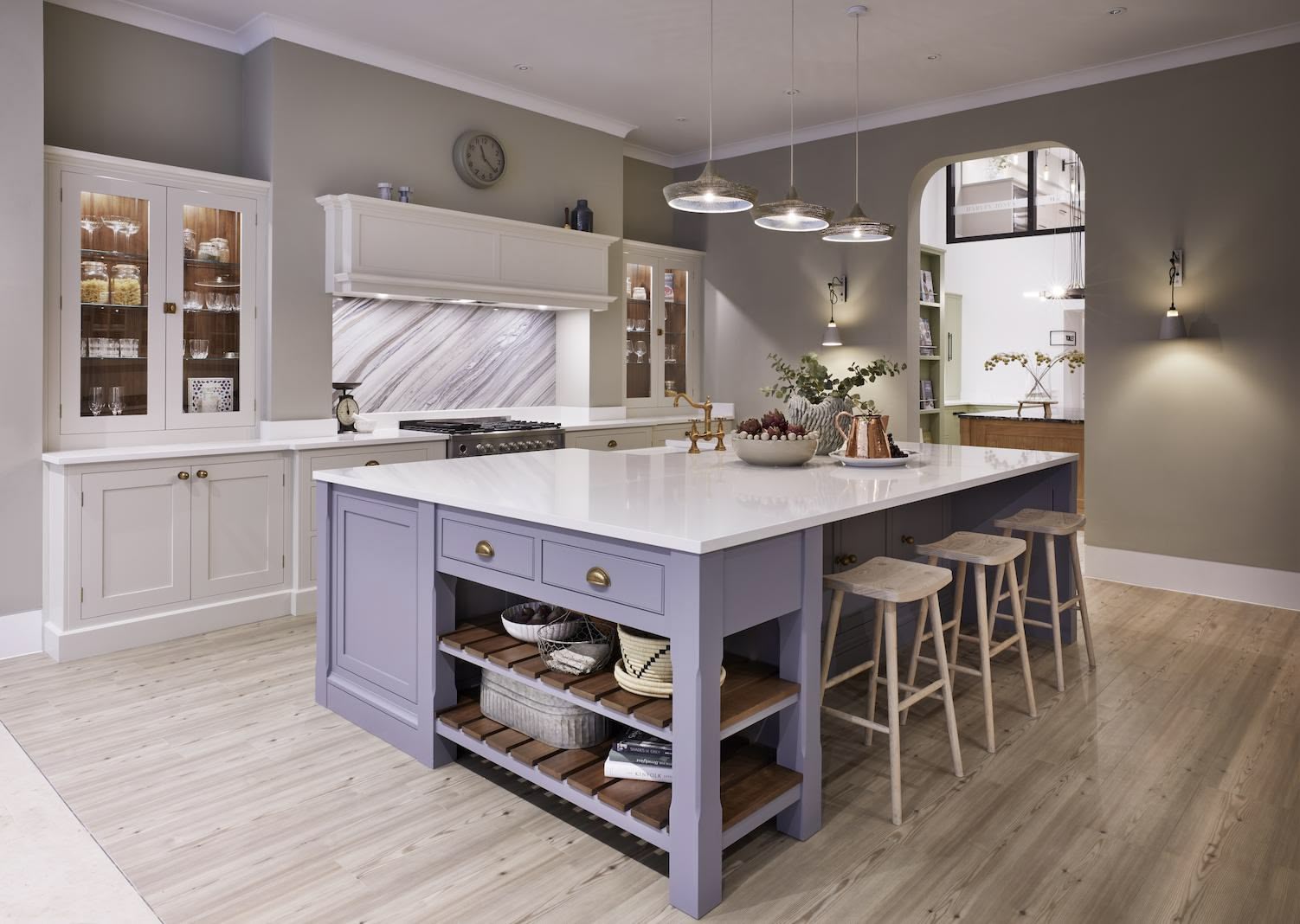 Blue kitchen island with white worktop and cream Original kitchen cabinetry