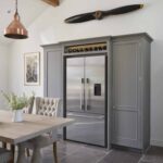 Grey Original kitchen cabinetry with American style fridge and wine storage