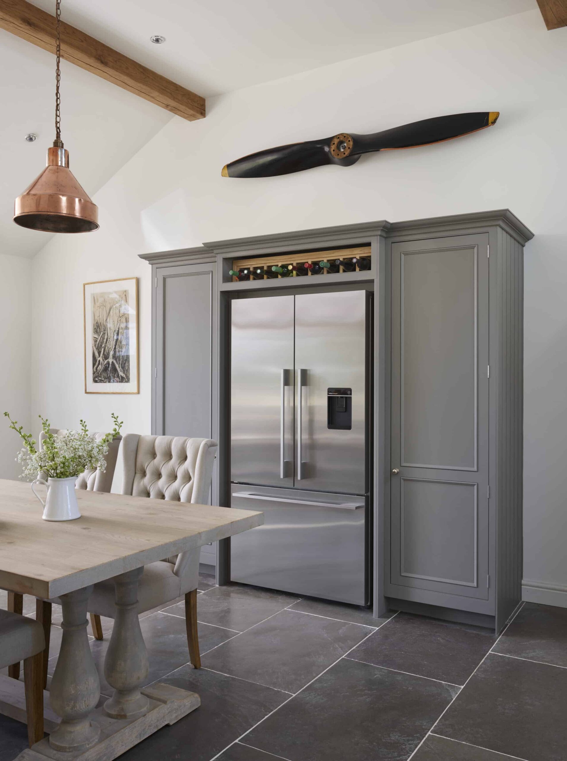 Grey Original kitchen cabinetry with American style fridge and wine storage