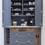 Harvey Jones blue kitchen dresser open to show organised shelving