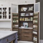 Open large pantry doors showing organised storage