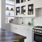 White Linear kitchen cabinetry with glass window doors