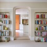 Orange Shaker pantry seen from living room archway