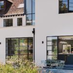 External view of kitchen seen through large glass sliding doors