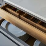 Grey Linear Edge kitchen drawer open to reveal oak storage dividers