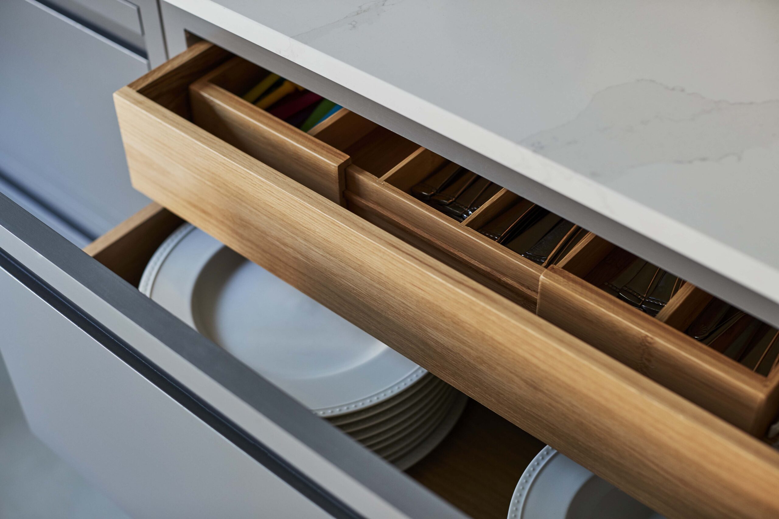 Grey Linear Edge kitchen drawer open to reveal oak storage dividers