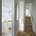 White kitchen seen from hallway