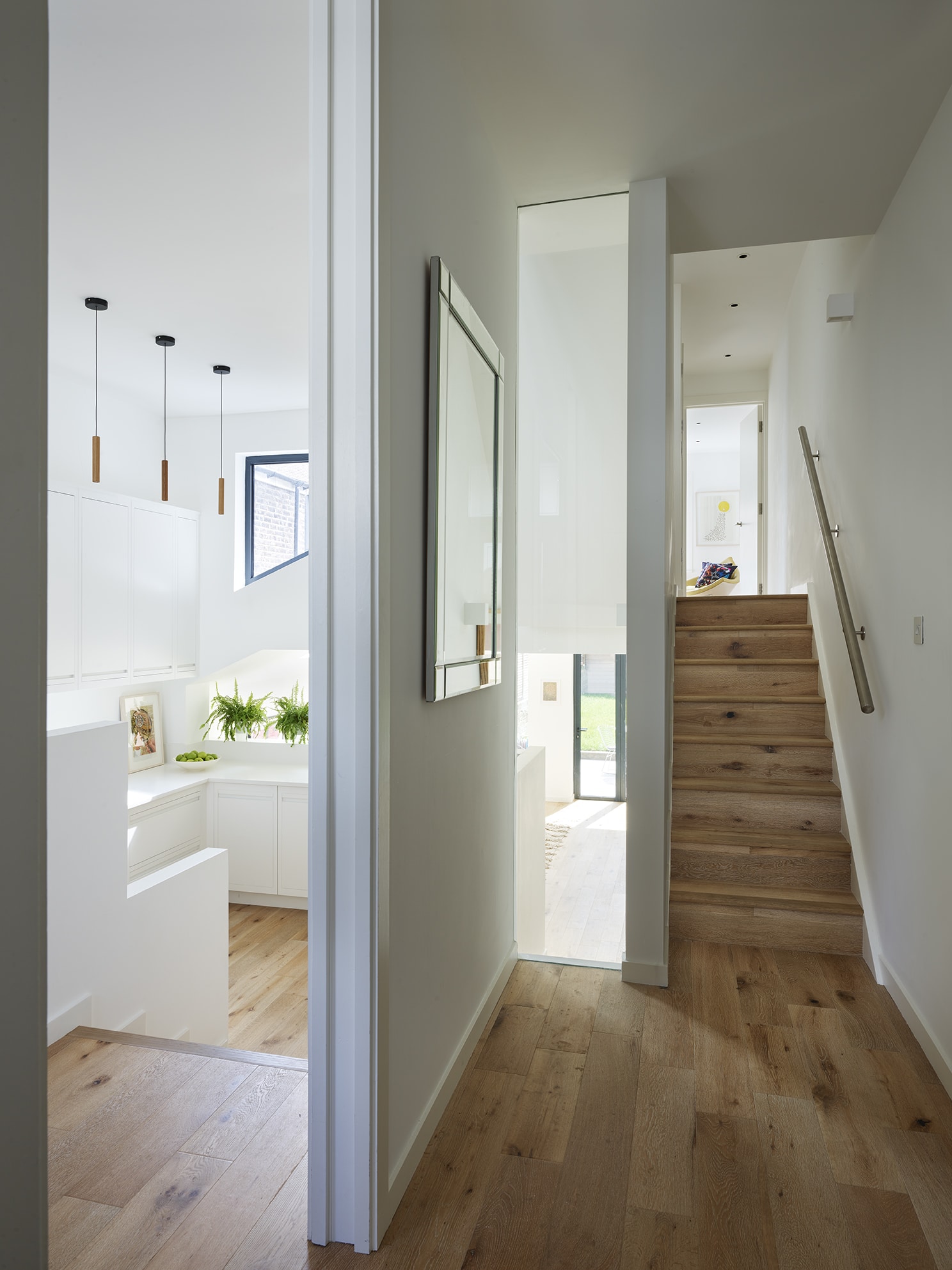 White kitchen seen from hallway