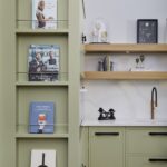 Green end panel with open shelving