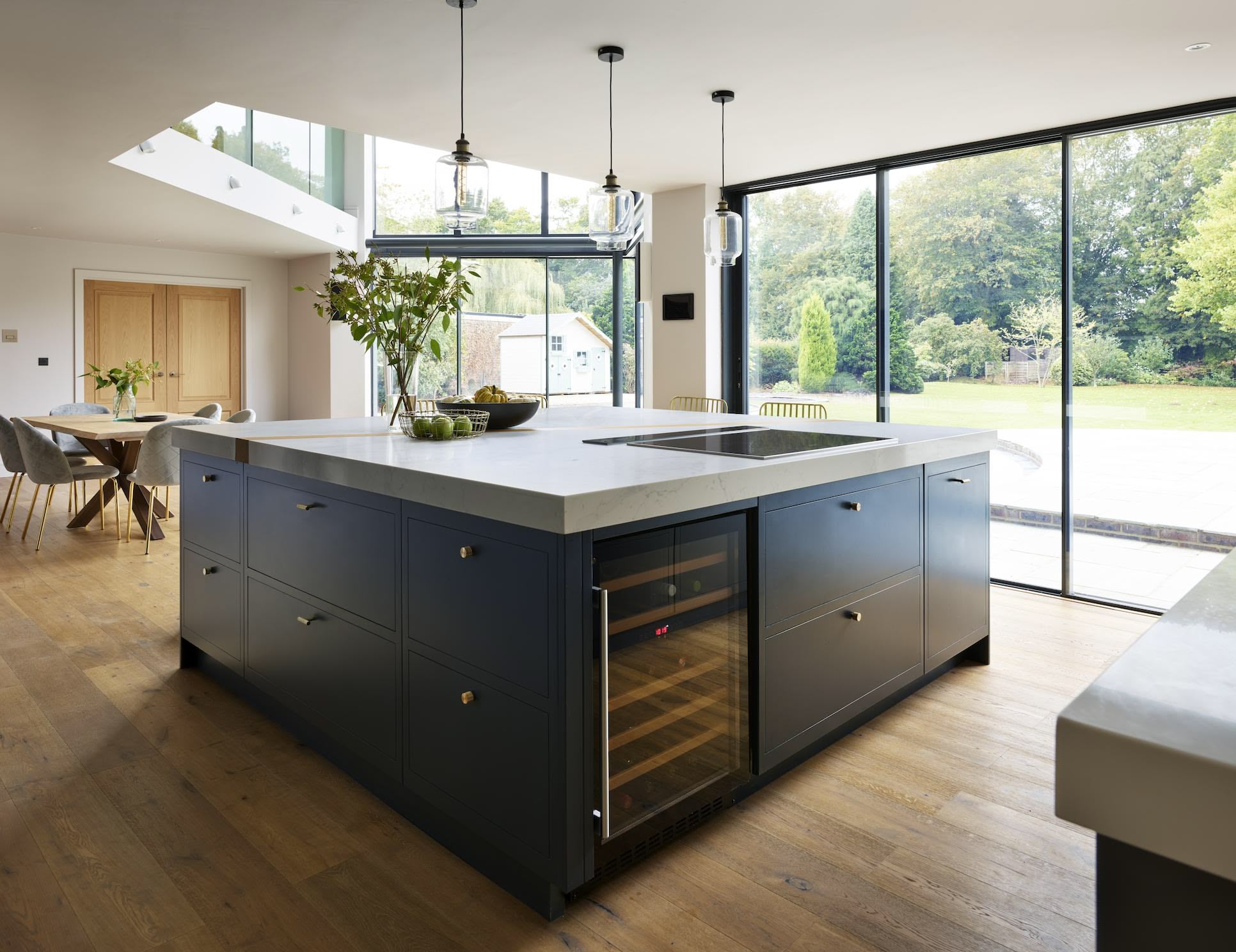 Dark kitchen island with wine fridge