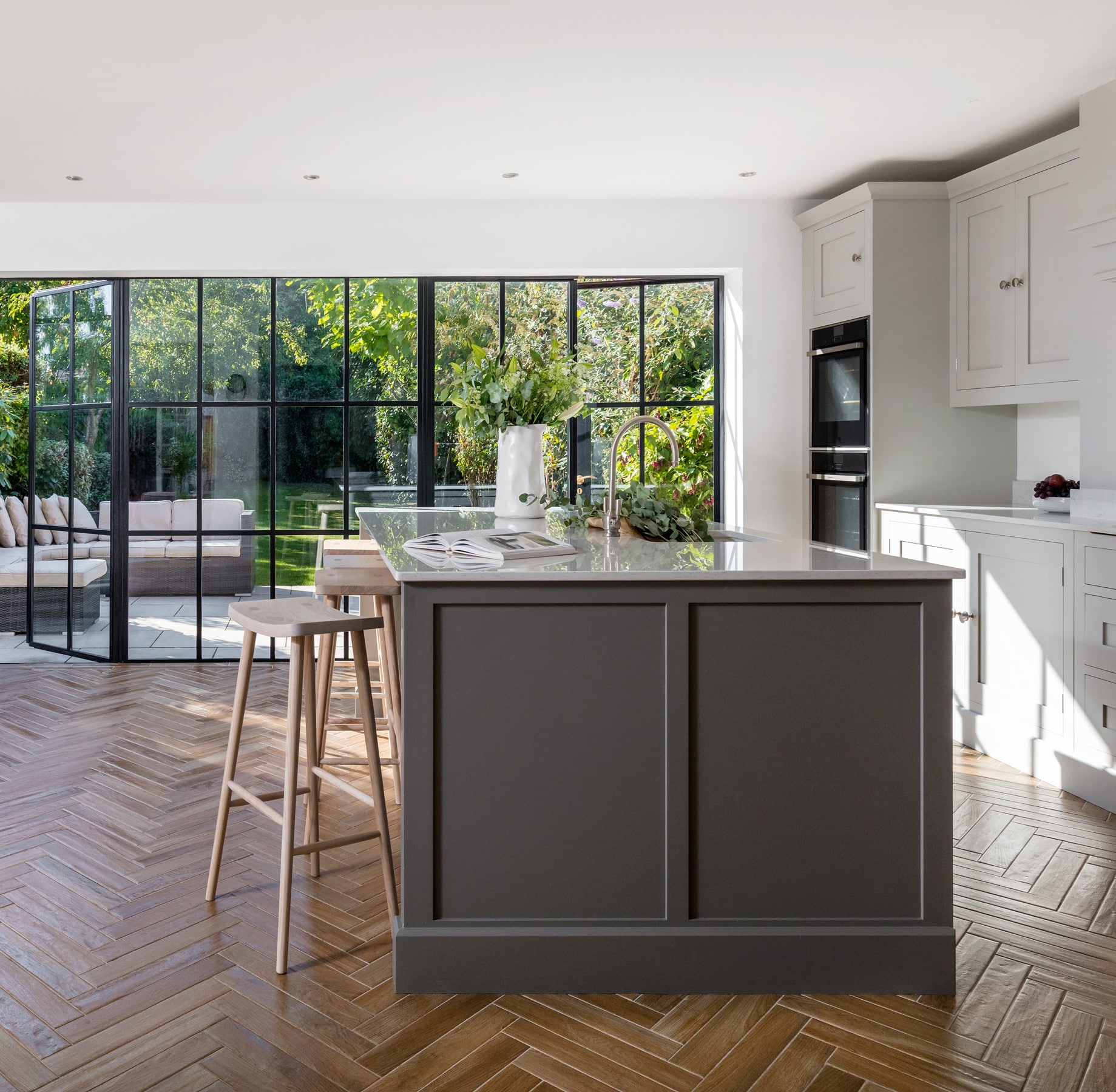 Smile stool against a grey kitchen island
