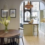 Arbor kitchen seen from a dining area in a Harvey Jones showroom