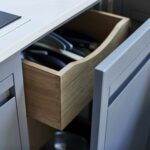 Grey Linear Edge kitchen drawer open to reveal oak storage