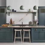 Nautural wooden smile stool against blue kitchen island