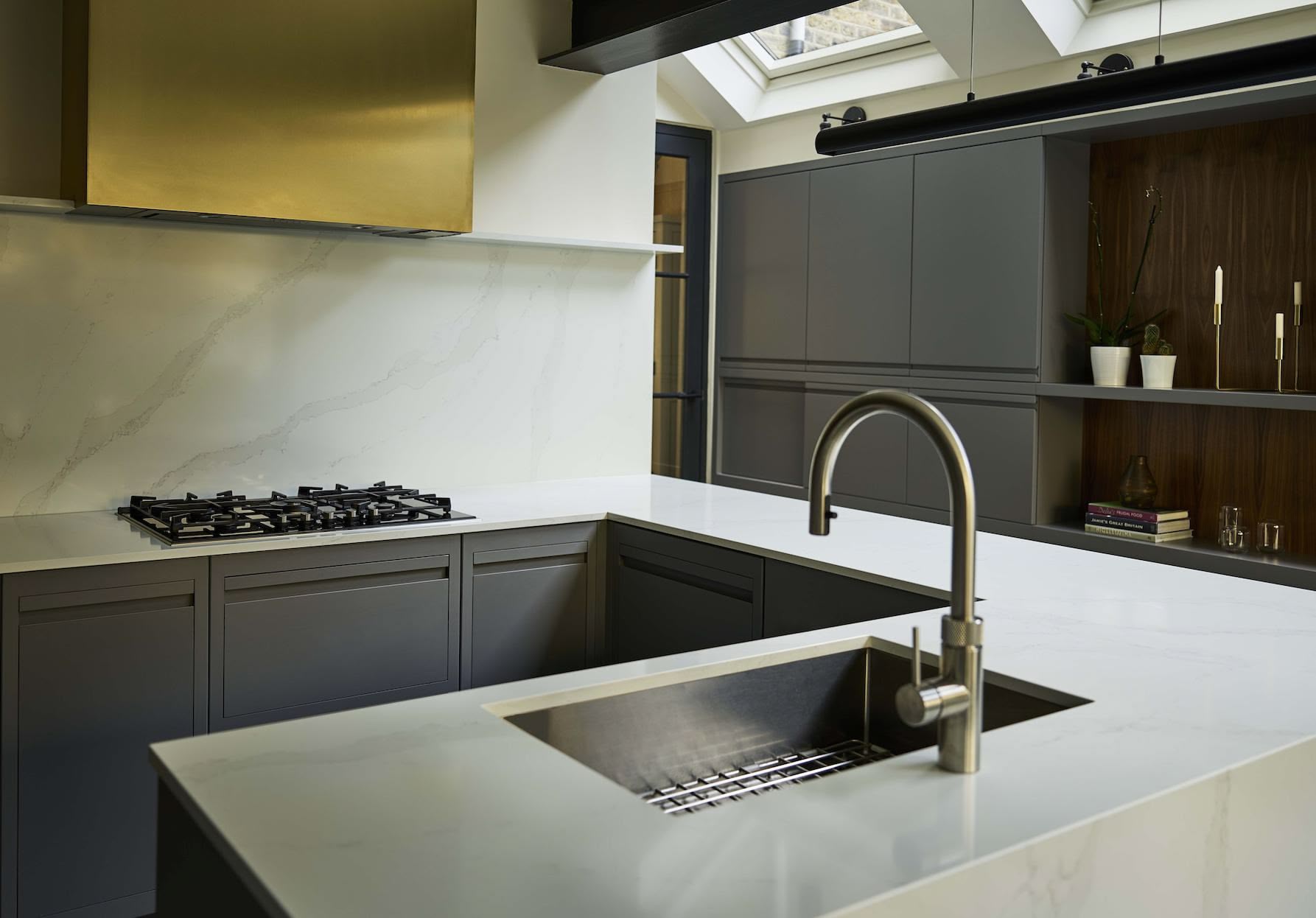 Grey Linear Edge kitchen island with white marble worktop featuring sink and integrated hob