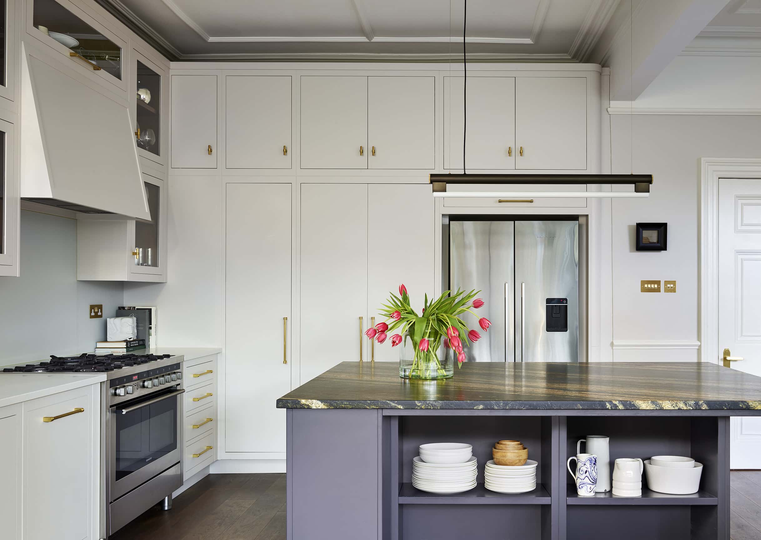 Blue kitchen island with open shelving
