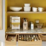 Harvey Jones white kitchen dresser open to show organised shelving