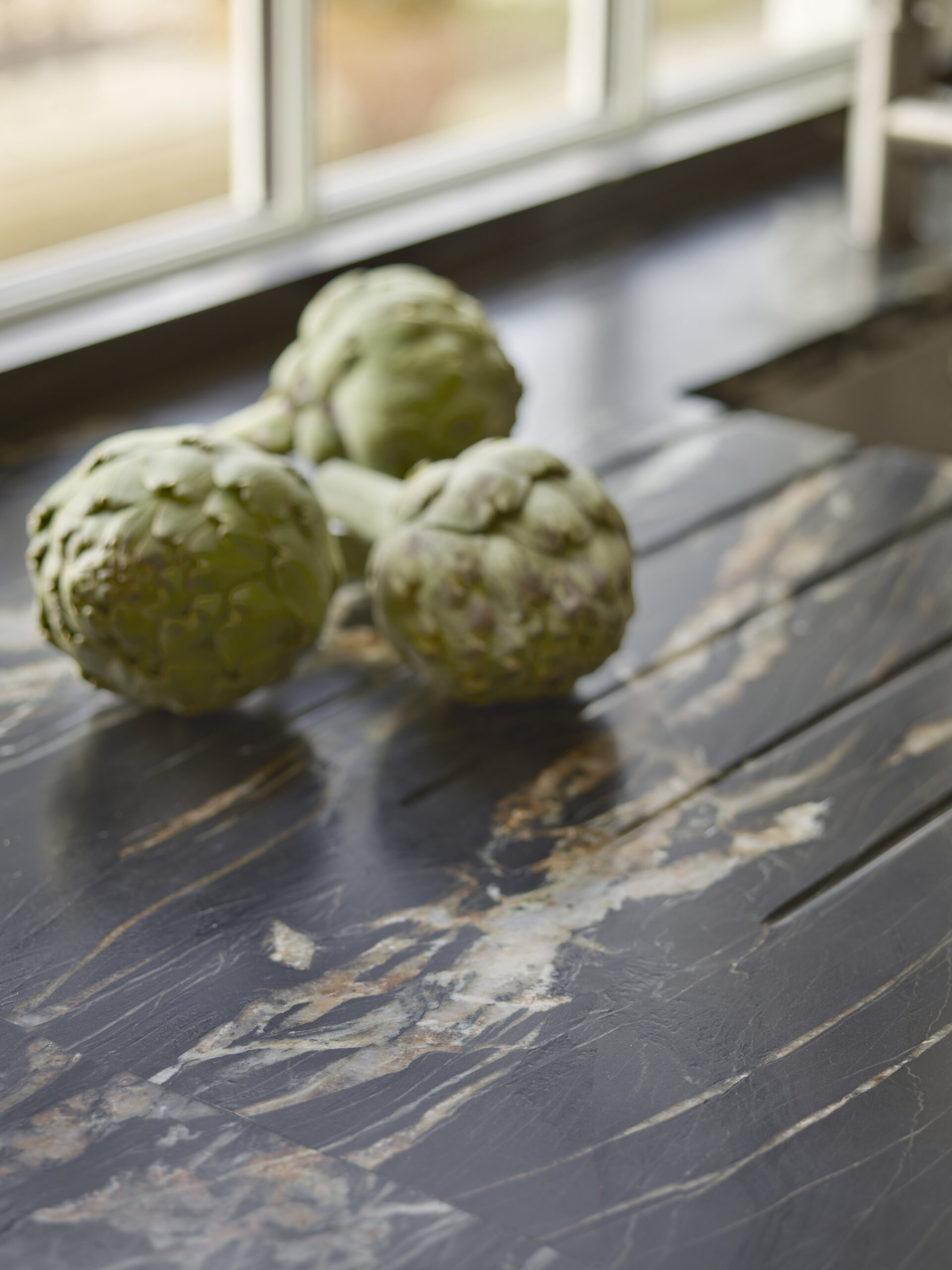 Closeup of black marble kitchen worktop