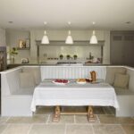 Kitchen dining nook featuring white banquette seating