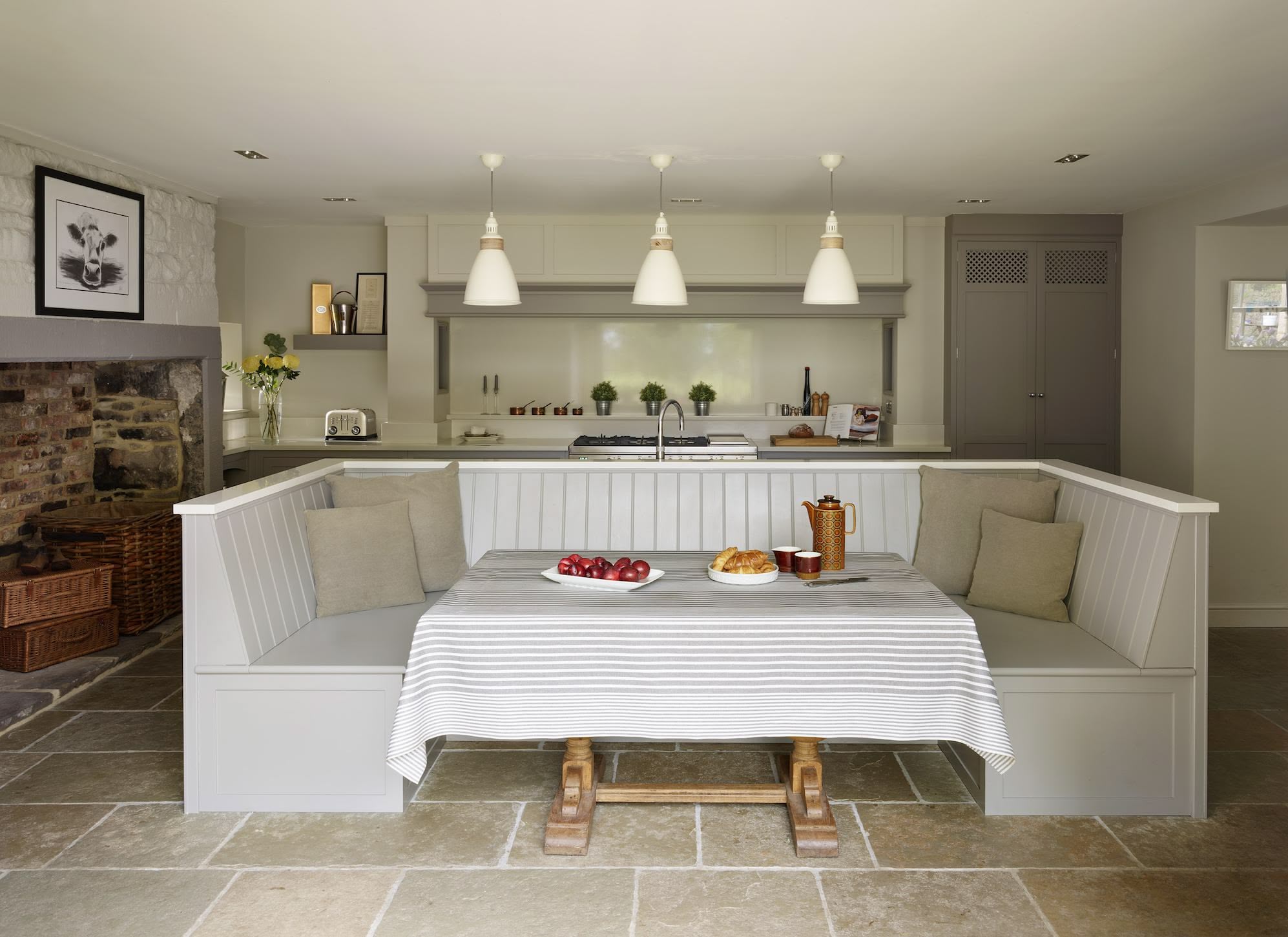 Kitchen dining nook featuring white banquette seating