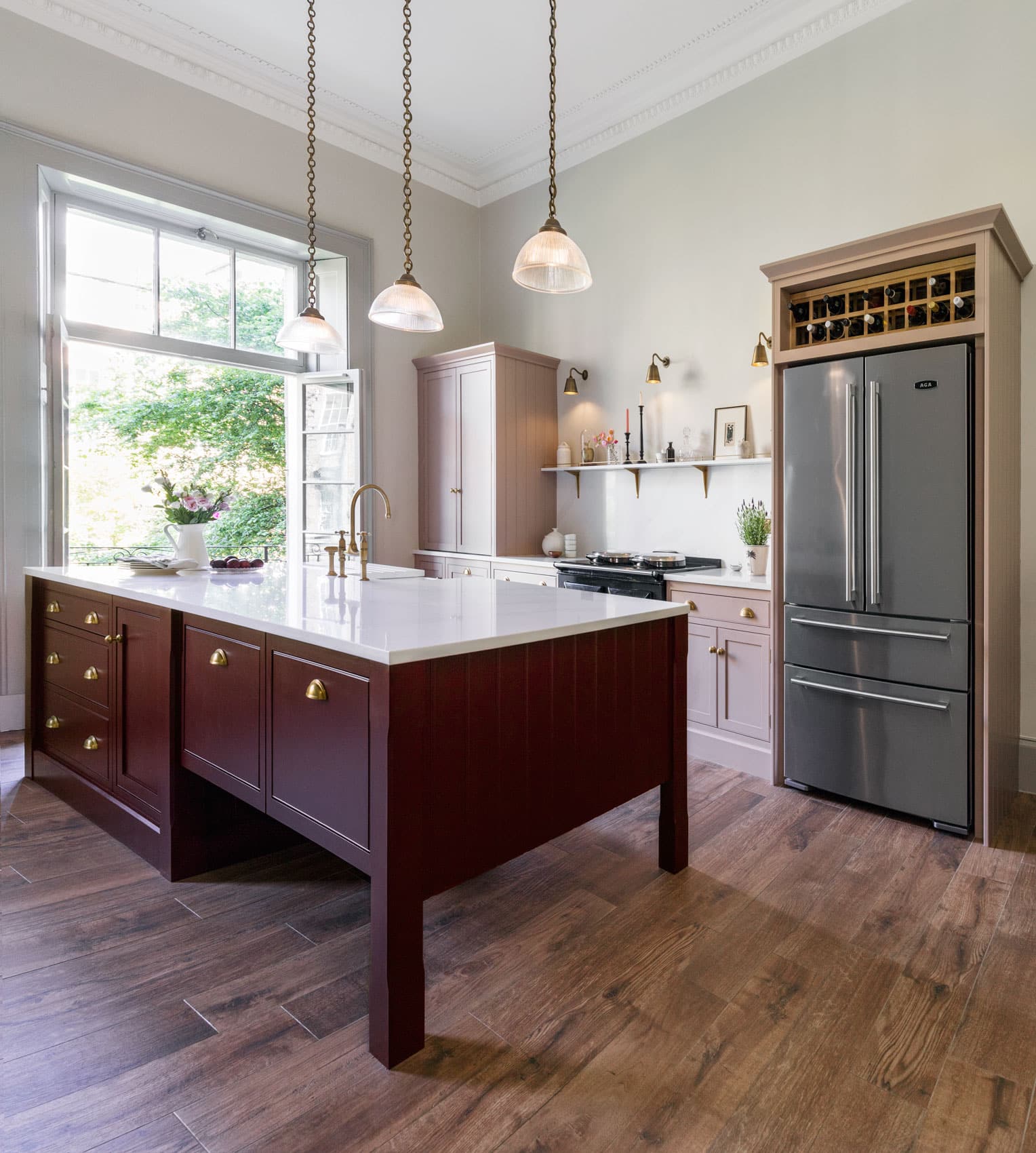 Arbor kitchen design featuring blush pink cabinetry, burgundy kitchen island and large silver American style refigerator