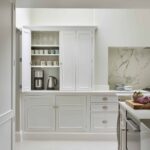 Harvey Jones white kitchen dresser open to show organised shelving
