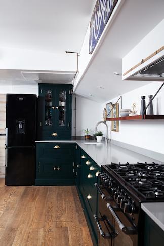Walnut open shelving above white kitchen worktop