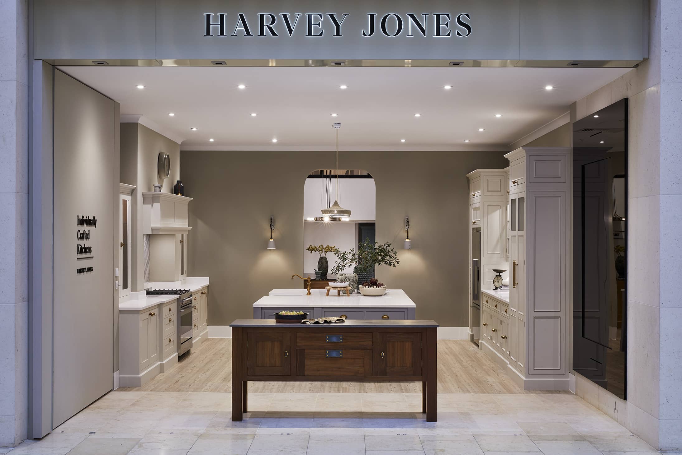 Harvey Jones showroom entrance featuring a dark wooden sideboard