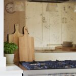 Distressed bronze tinted mirrored splashback
