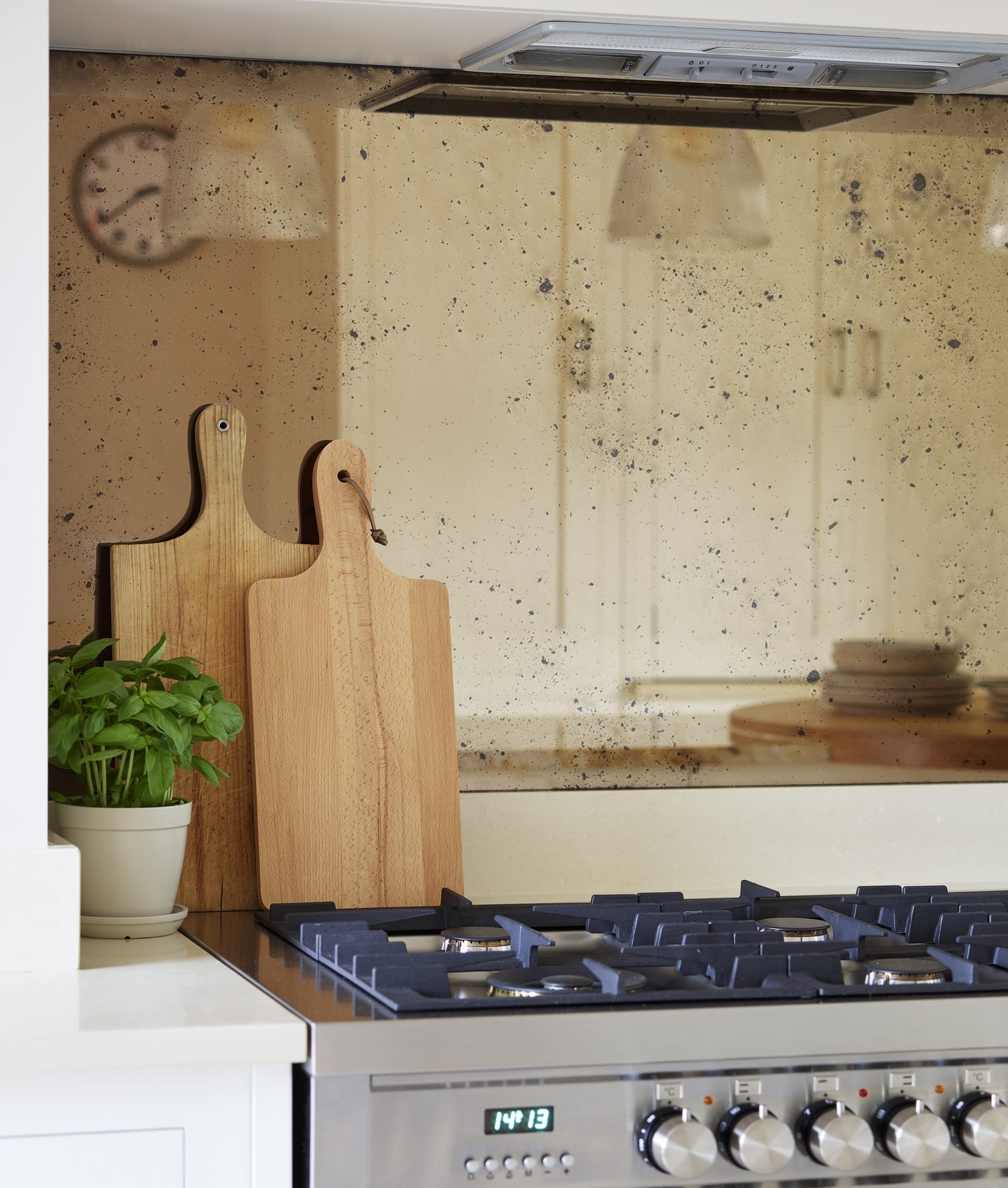 Distressed bronze tinted mirrored splashback