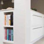 White Linear kitchen island end panel featuring bookshelving