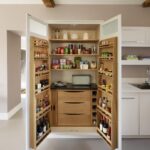 Open large pantry doors showing organised storage